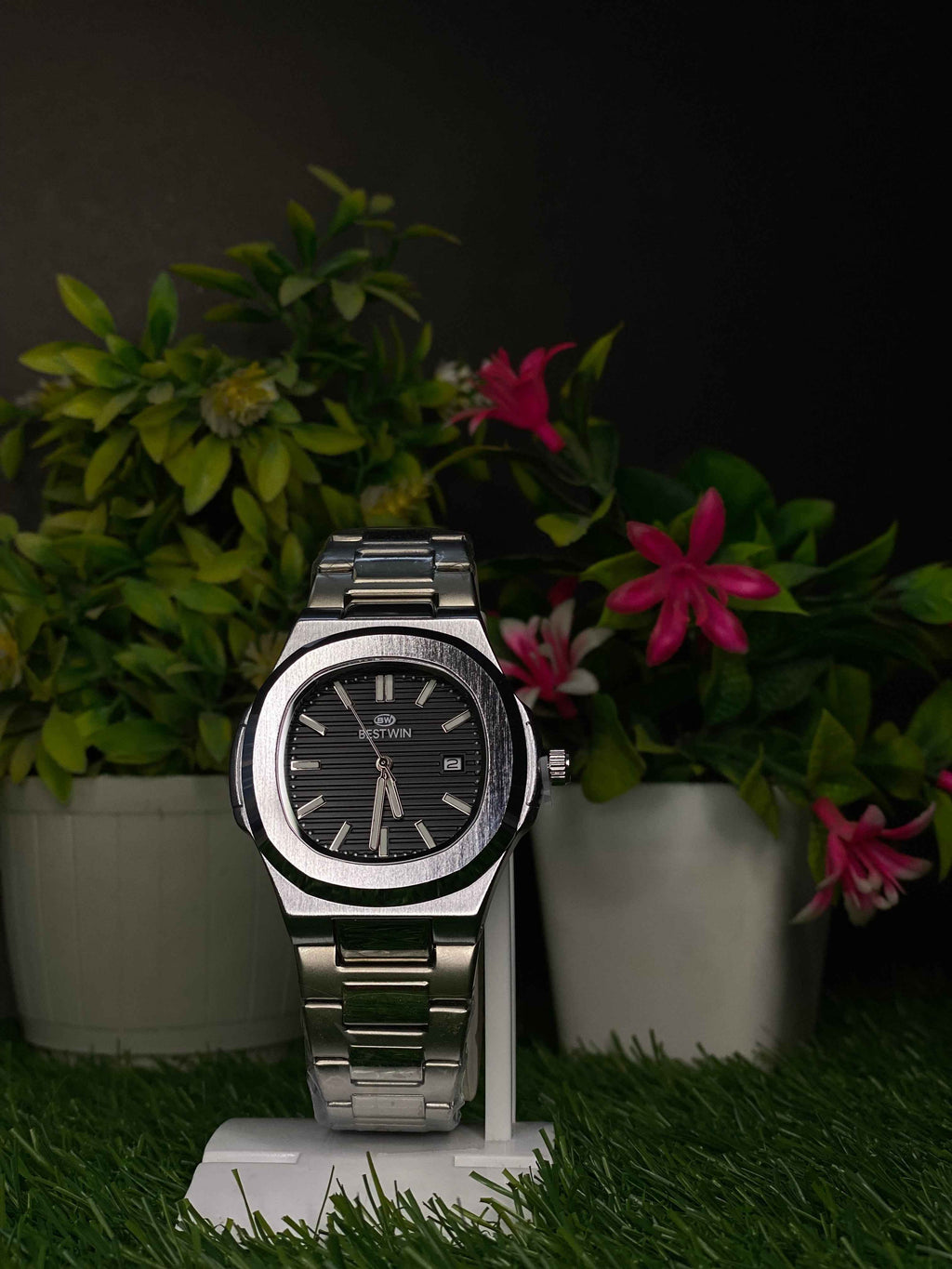 Modern Stainless Steel Watch with Black Textured Dial Display