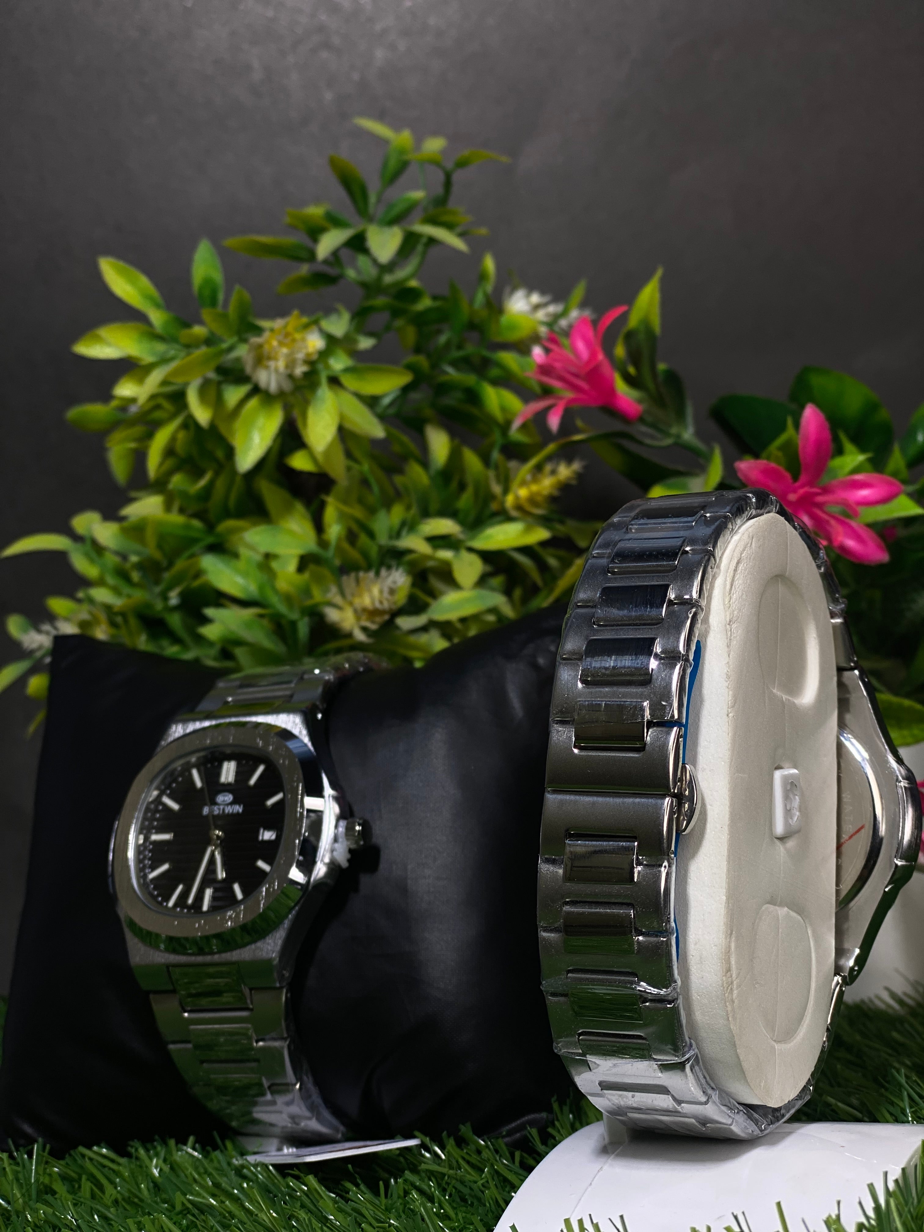 Modern Stainless Steel Watch with Black Textured Dial Display