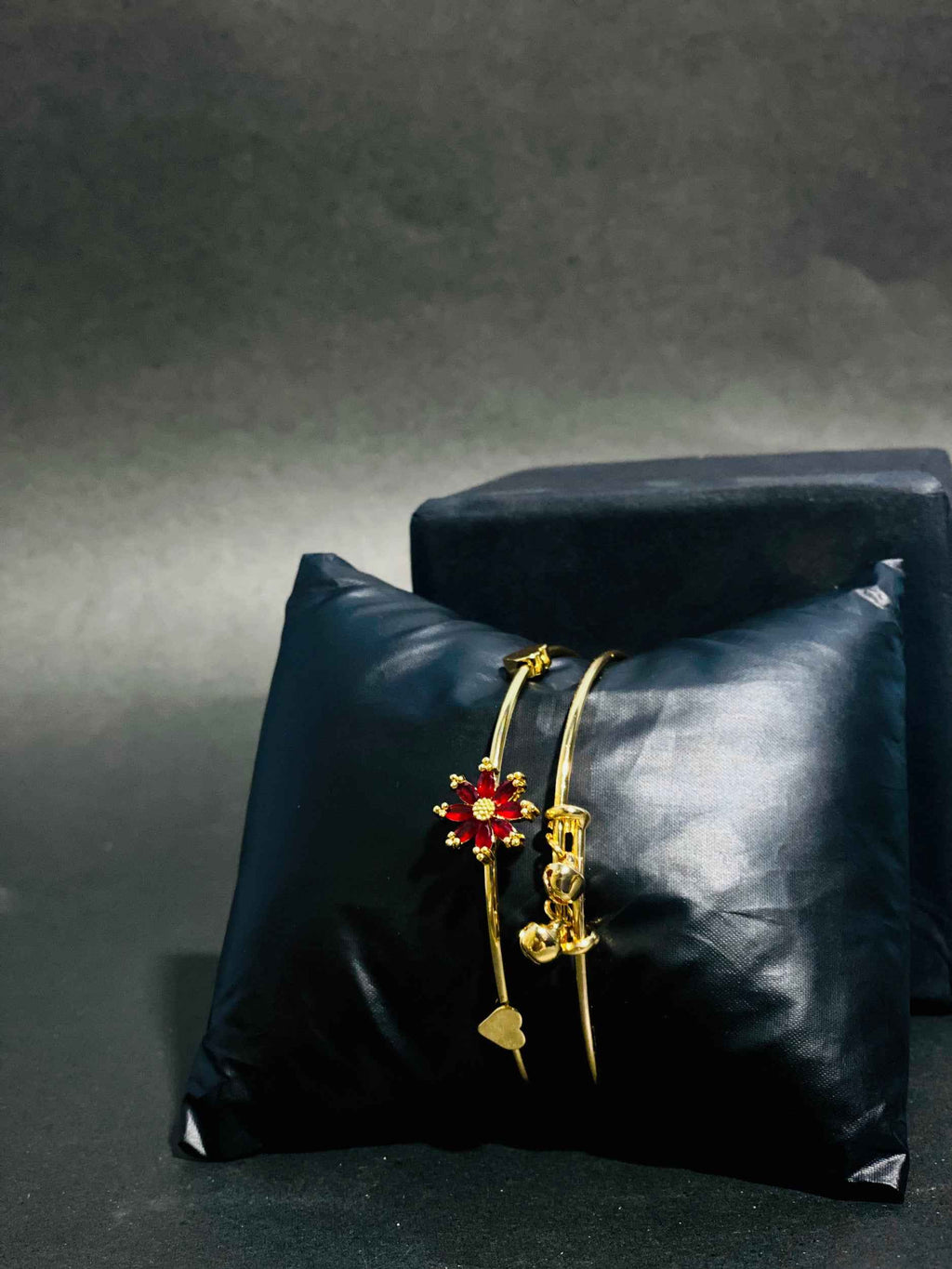 Elegant Gold Bangles with Red Floral Gemstone Design