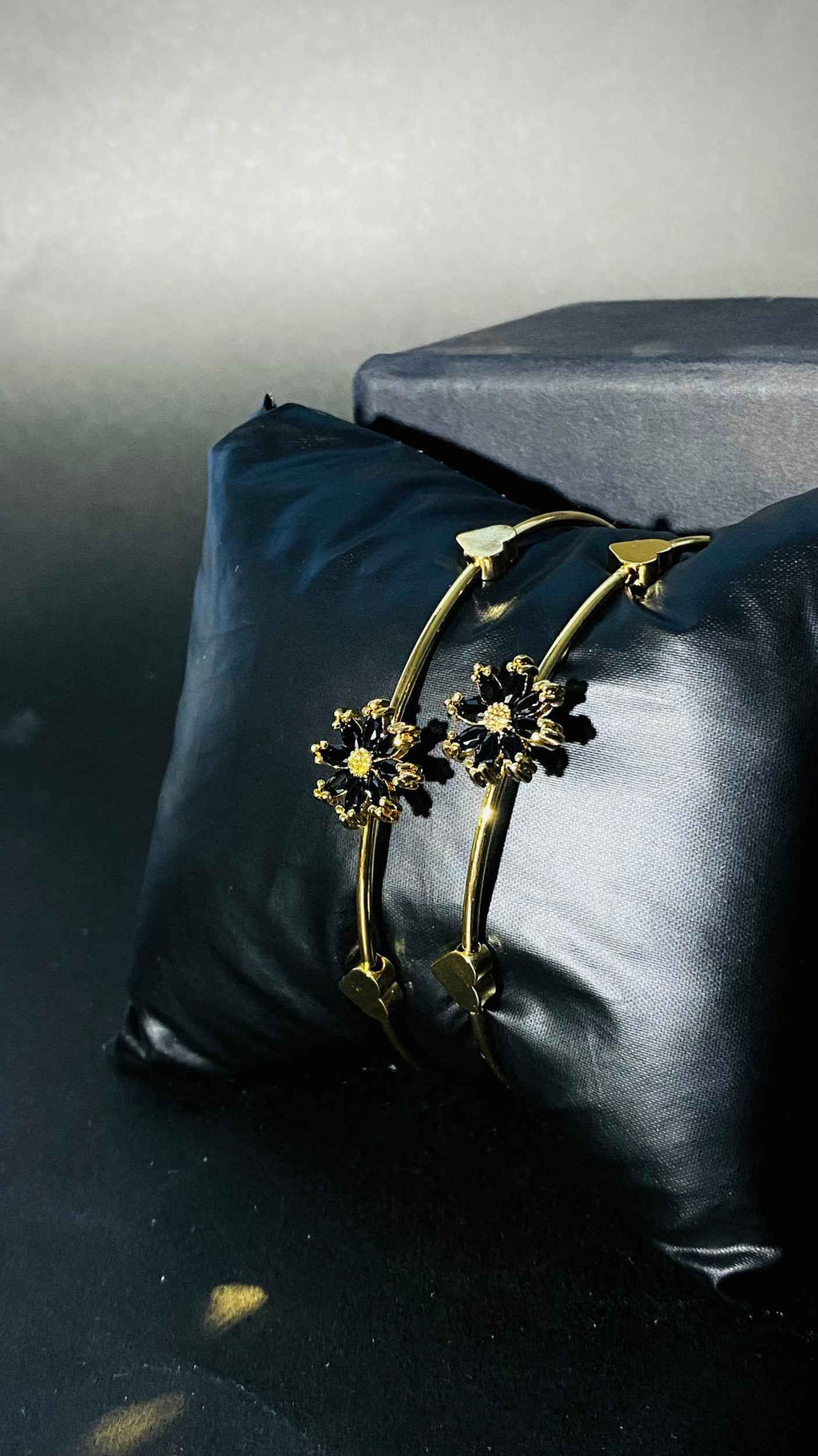 Elegant Gold Bangles with Black Floral Gemstone Accents