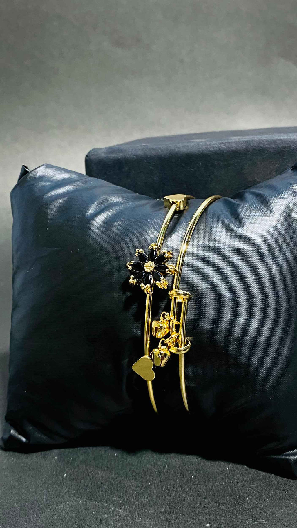 Elegant Gold Bangles with Black Floral Gemstone Accents