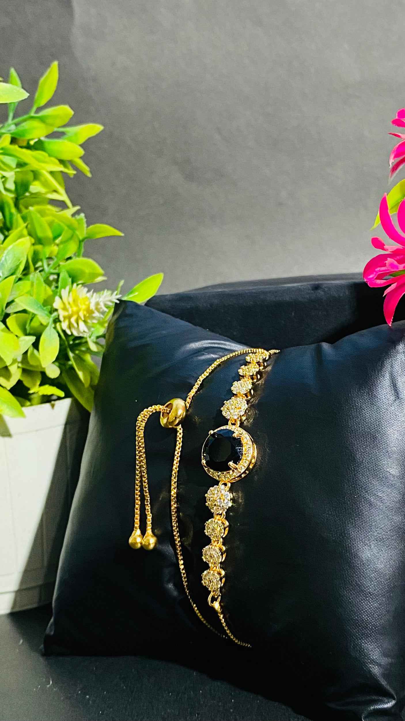 Luxurious Black Stone Bracelet with Gold and Diamond Accents