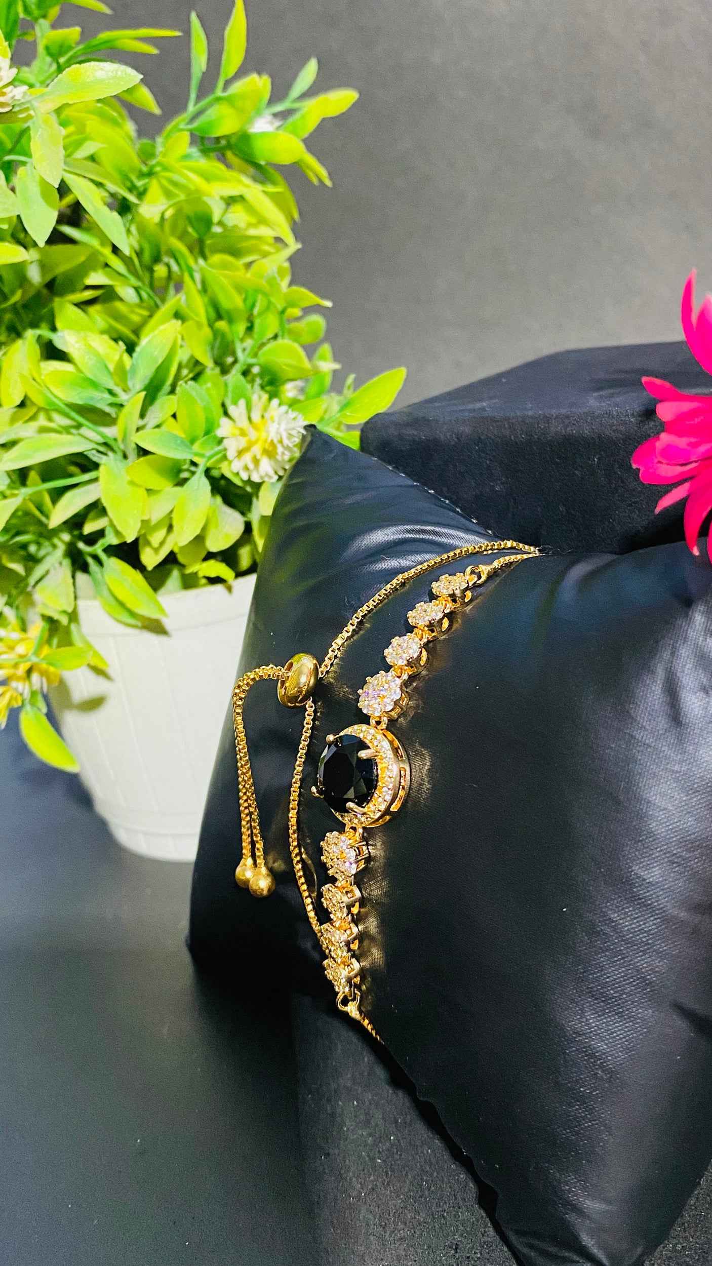 Luxurious Black Stone Bracelet with Gold and Diamond Accents