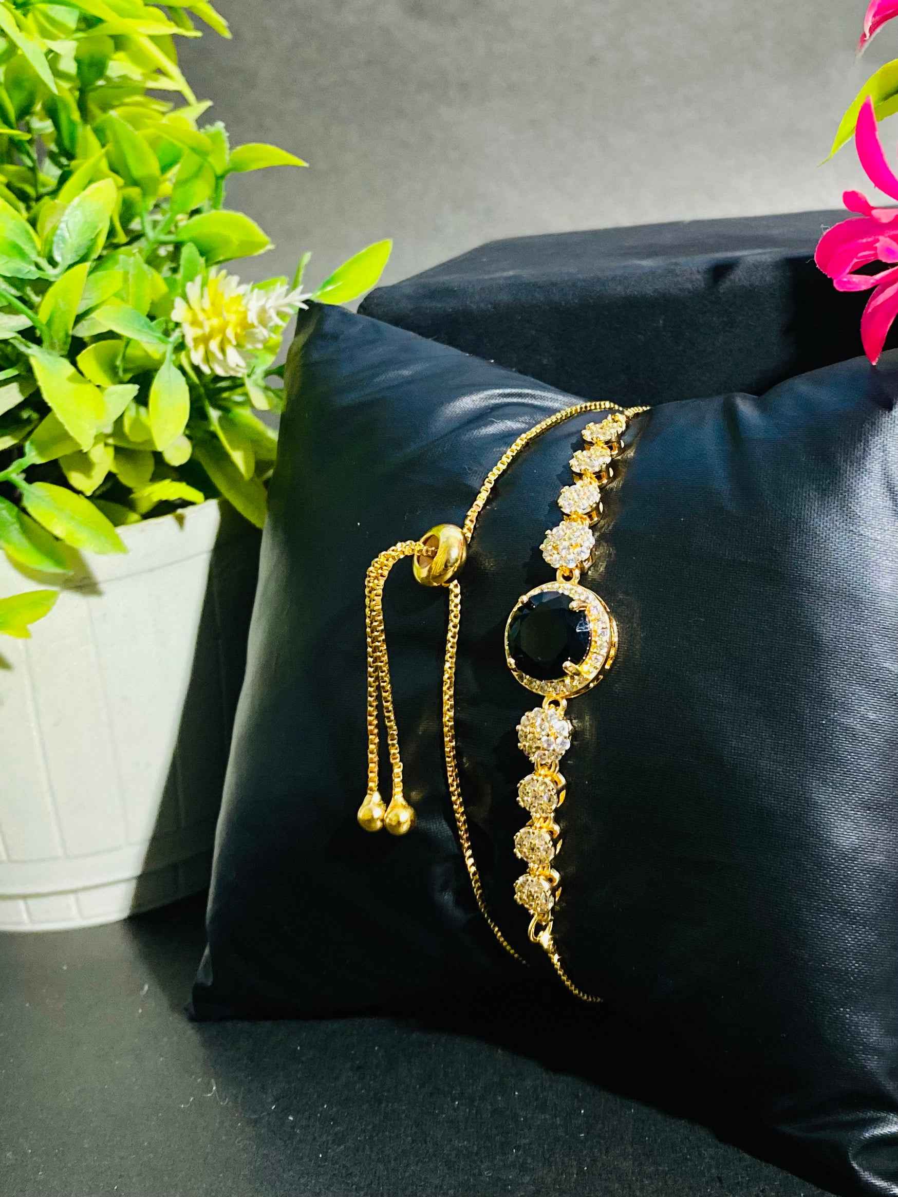 Luxurious Black Stone Bracelet with Gold and Diamond Accents