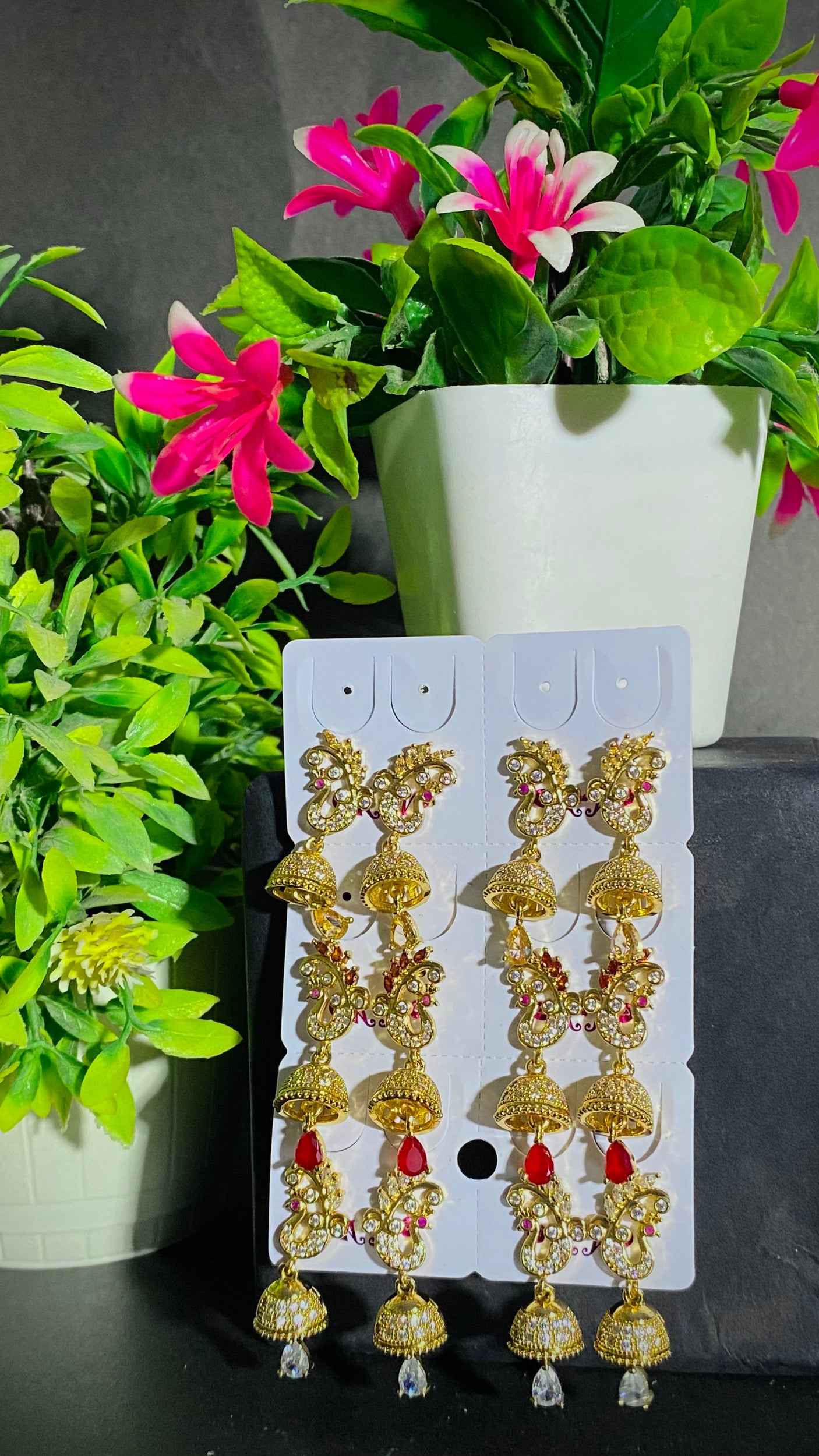 Royal Gold Jhumka Earrings with Red Stone Accents – Traditional Charm with Modern Grace